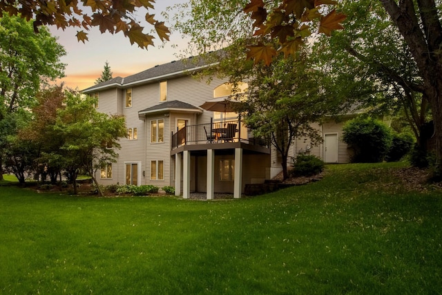 16976 81st Ave N, Maple Grove, MN 55311 - back of property at dusk featuring a lawn and a deck