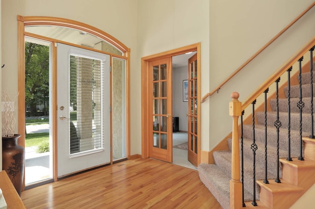16976 81st Ave N, Maple Grove, MN 55311 - foyer entrance featuring wood finished floors, french doors, and stairway