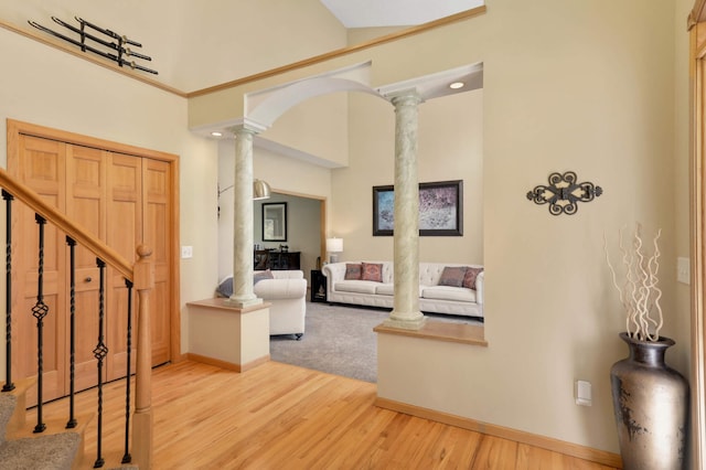 16976 81st Ave N, Maple Grove, MN 55311 - foyer entrance featuring ornate columns, wood finished floors, baseboards, and stairs