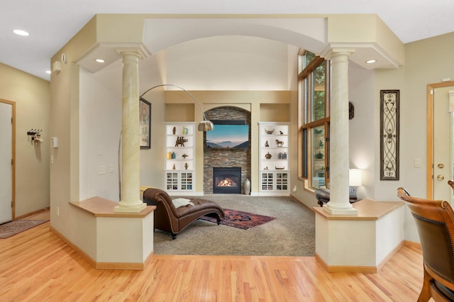 16976 81st Ave N, Maple Grove, MN 55311 - living area with decorative columns, light wood-style flooring, baseboards, a fireplace, and recessed lighting