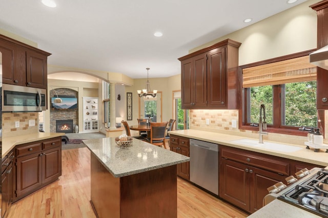 16976 81st Ave N, Maple Grove, MN 55311 - kitchen featuring stainless steel appliances, a sink, a center island, healthy amount of natural light, and recessed lighting