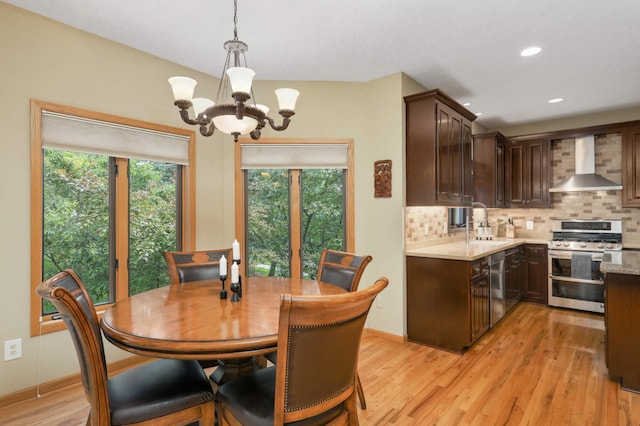 16976 81st Ave N, Maple Grove, MN 55311 - dining space with a chandelier, light wood-type flooring, recessed lighting, and baseboards
