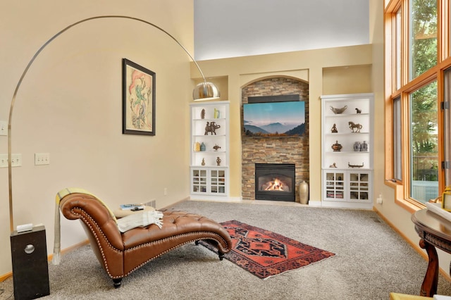 16976 81st Ave N, Maple Grove, MN 55311 - carpeted living room with built in shelves, a fireplace, and baseboards