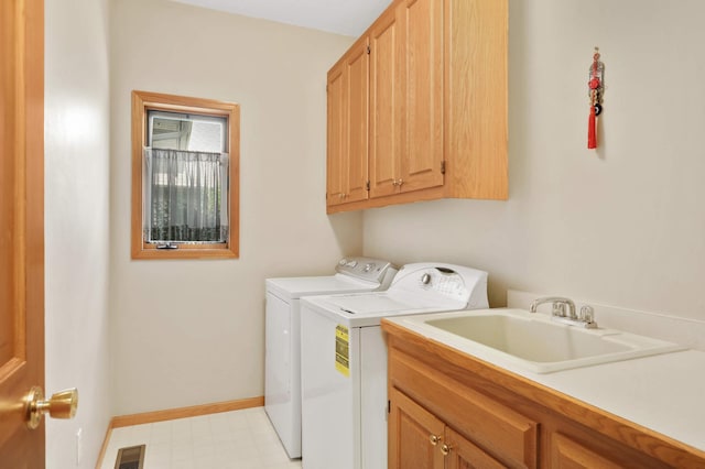 16976 81st Ave N, Maple Grove, MN 55311 - laundry room featuring washing machine and clothes dryer, cabinet space, light floors, and baseboards
