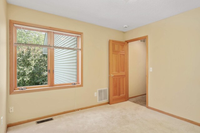 16976 81st Ave N, Maple Grove, MN 55311 - carpeted spare room featuring baseboards