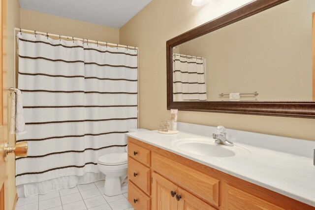 16976 81st Ave N, Maple Grove, MN 55311 - bathroom with vanity, tile patterned floors, toilet, and a shower with shower curtain