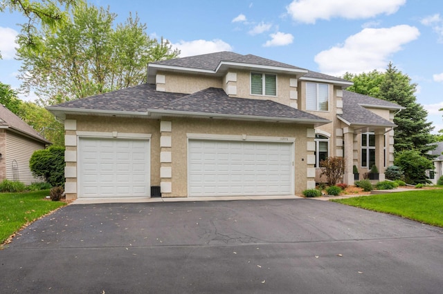 16976 81st Ave N, Maple Grove, MN 55311 - prairie-style home with asphalt driveway, stucco siding, a garage, and a shingled roof