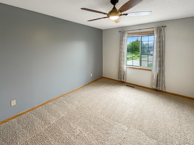 2002 Willow Cir, Centerville, MN 55038 - carpeted empty room with a ceiling fan, baseboards, and a textured ceiling