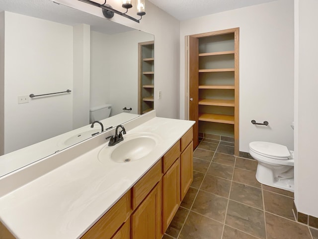 2002 Willow Cir, Centerville, MN 55038 - bathroom featuring toilet, vanity, and tile patterned flooring