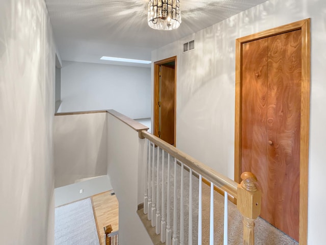 2002 Willow Cir, Centerville, MN 55038 - stairs featuring wood finished floors and a chandelier