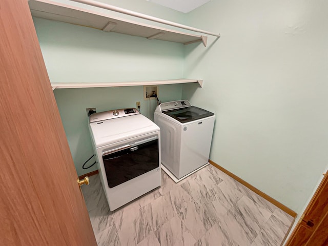 2002 Willow Cir, Centerville, MN 55038 - washroom with washing machine and dryer, baseboards, and light marble finish floors