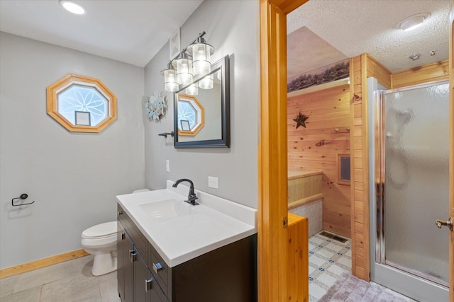 9407 St Odilia Beach Rd, Vermilion Lake Twp, MN 55790 - full bathroom featuring vanity, a stall shower, and tile patterned floors
