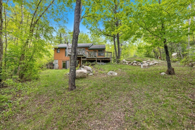 9407 St Odilia Beach Rd, Vermilion Lake Twp, MN 55790 - view of grassy yard with a deck