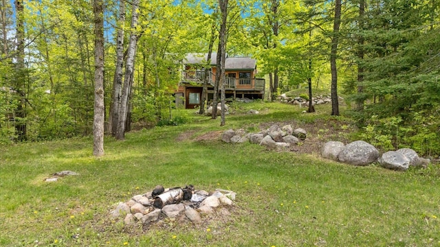 9407 St Odilia Beach Rd, Vermilion Lake Twp, MN 55790 - view of grassy yard featuring a deck and a wooded view