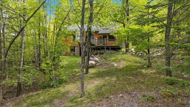 9407 St Odilia Beach Rd, Vermilion Lake Twp, MN 55790 - view of yard featuring a deck and a forest view