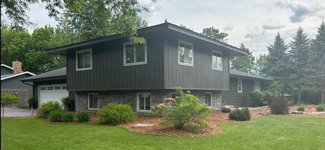 4322 Rustic Pl, Shoreview, MN 55126 - view of property exterior featuring a lawn, a garage, and stone siding