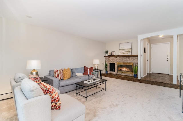 6085 Lincoln Dr Unit 220, Edina, MN 55436 - living room with arched walkways, carpet floors, a fireplace, and baseboard heating
