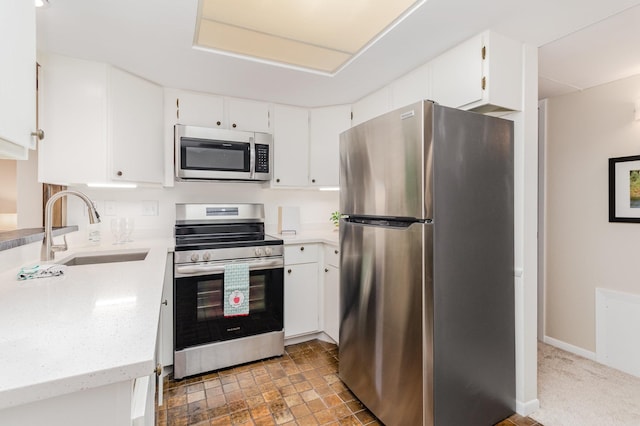 6085 Lincoln Dr Unit 220, Edina, MN 55436 - kitchen with appliances with stainless steel finishes, a sink, white cabinets, and light stone countertops