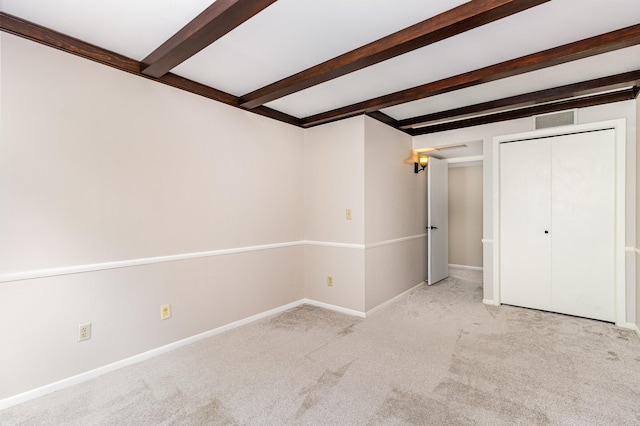 6085 Lincoln Dr Unit 220, Edina, MN 55436 - unfurnished bedroom with carpet flooring, beamed ceiling, baseboards, and a closet