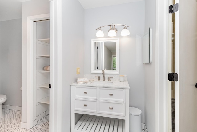 6085 Lincoln Dr Unit 220, Edina, MN 55436 - bathroom featuring toilet, vanity, and tile patterned floors