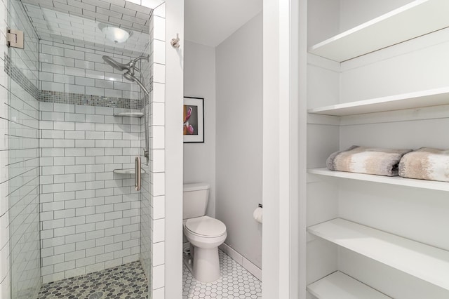 6085 Lincoln Dr Unit 220, Edina, MN 55436 - full bathroom with a stall shower, toilet, and tile patterned flooring