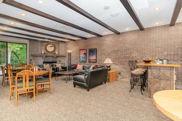 6085 Lincoln Dr Unit 220, Edina, MN 55436 - living area featuring beam ceiling, a fireplace, brick wall, and recessed lighting