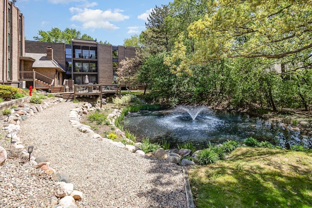 6085 Lincoln Dr Unit 220, Edina, MN 55436 - view of yard with a garden pond and a wooden deck