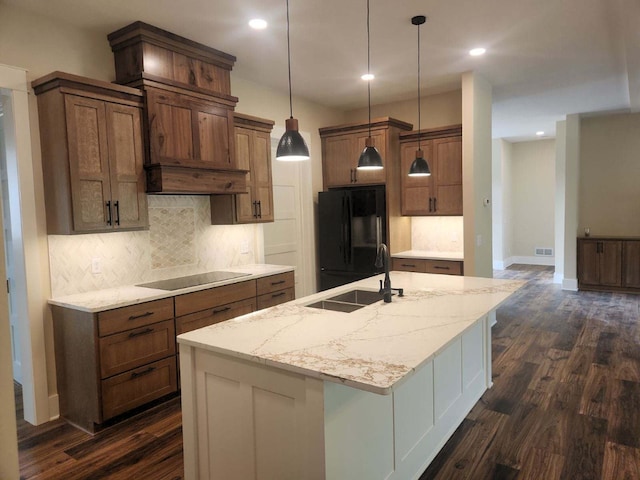 8800 86th Ave N, Greenfield, MN 55373 - kitchen with black appliances, dark wood finished floors, tasteful backsplash, an island with sink, and recessed lighting