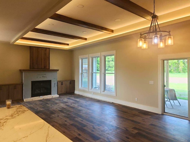 8800 86th Ave N, Greenfield, MN 55373 - unfurnished living room with beamed ceiling, a fireplace, dark wood-style flooring, a chandelier, and recessed lighting