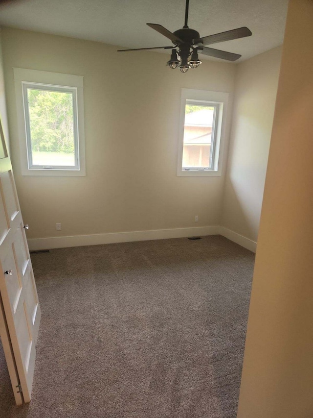 8800 86th Ave N, Greenfield, MN 55373 - empty room featuring a ceiling fan and carpet flooring