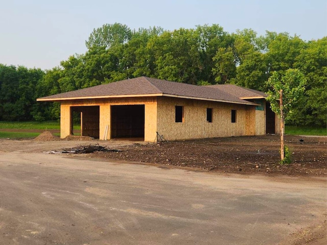 8800 86th Ave N, Greenfield, MN 55373 - view of side of home featuring an outdoor structure
