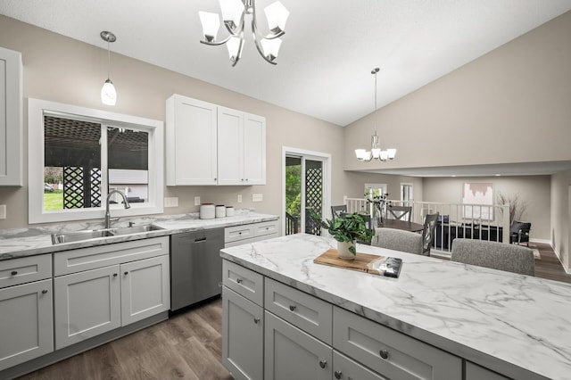 3825 122nd Ave NW, Coon Rapids, MN 55433 - kitchen with a chandelier, stainless steel dishwasher, a sink, dark wood finished floors, and light stone countertops