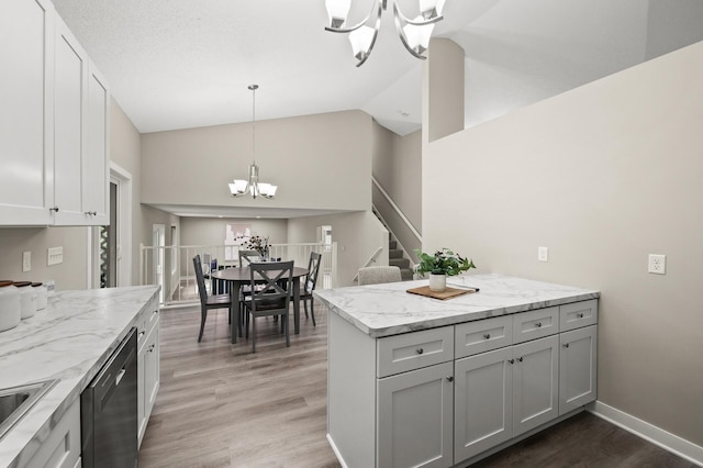 3825 122nd Ave NW, Coon Rapids, MN 55433 - kitchen with a chandelier, dishwashing machine, light wood finished floors, light stone counters, and decorative light fixtures