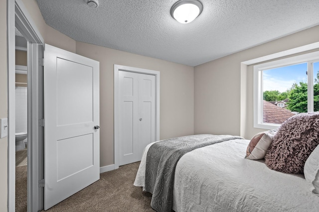 3825 122nd Ave NW, Coon Rapids, MN 55433 - carpeted bedroom featuring a textured ceiling and baseboards