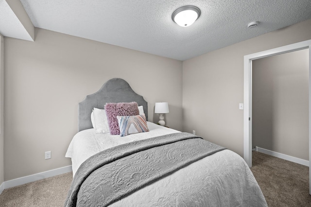 3825 122nd Ave NW, Coon Rapids, MN 55433 - carpeted bedroom featuring baseboards and a textured ceiling