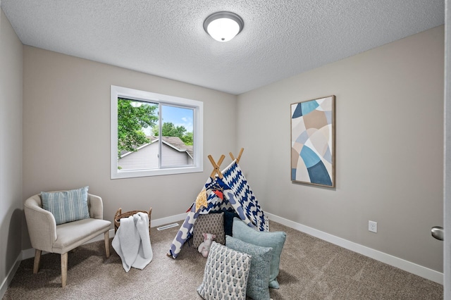 3825 122nd Ave NW, Coon Rapids, MN 55433 - recreation room featuring a textured ceiling, carpet flooring, and baseboards