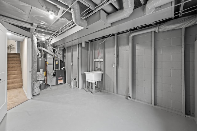 3825 122nd Ave NW, Coon Rapids, MN 55433 - unfinished below grade area with heating unit, stairway, and gas water heater