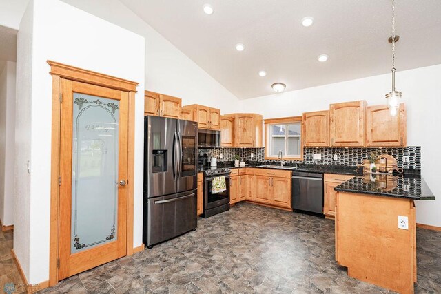 7214 Eagle Pointe Dr S, Fargo, ND 58104 - kitchen featuring stainless steel appliances, dark countertops, lofted ceiling, a peninsula, and a sink