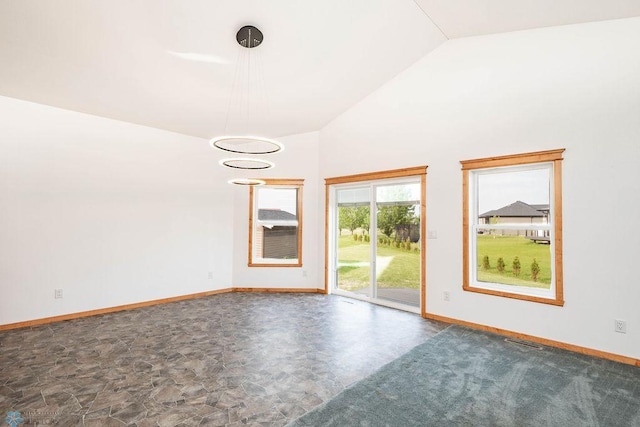 7214 Eagle Pointe Dr S, Fargo, ND 58104 - spare room featuring baseboards and high vaulted ceiling