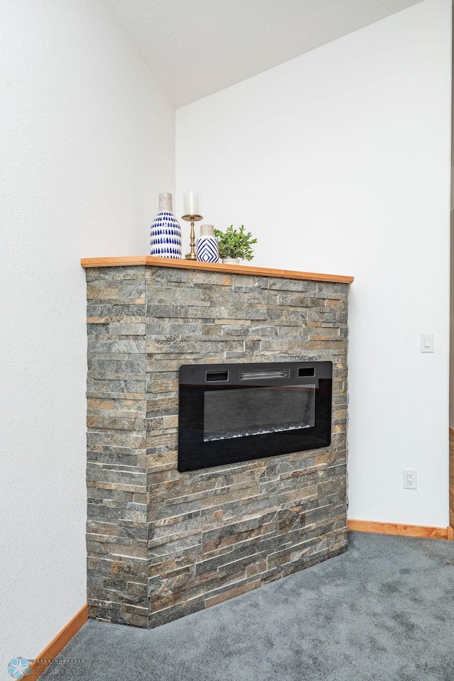 7214 Eagle Pointe Dr S, Fargo, ND 58104 - detailed view of carpet, a fireplace, and baseboards