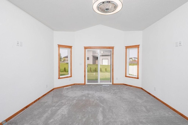 7214 Eagle Pointe Dr S, Fargo, ND 58104 - carpeted spare room with lofted ceiling and baseboards