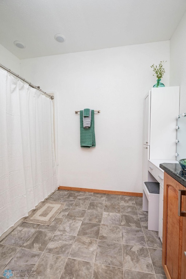 7214 Eagle Pointe Dr S, Fargo, ND 58104 - bathroom featuring vanity and baseboards