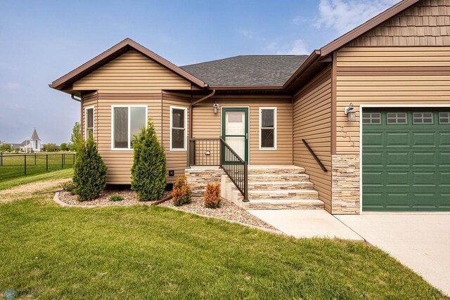7214 Eagle Pointe Dr S, Fargo, ND 58104 - ranch-style house featuring a garage, a shingled roof, and concrete driveway