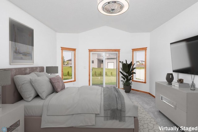 7214 Eagle Pointe Dr S, Fargo, ND 58104 - bedroom with access to outside, vaulted ceiling, and baseboards