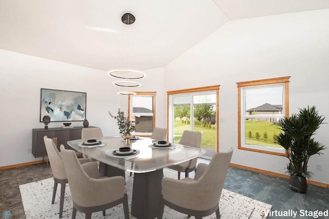 7214 Eagle Pointe Dr S, Fargo, ND 58104 - dining room with baseboards and vaulted ceiling