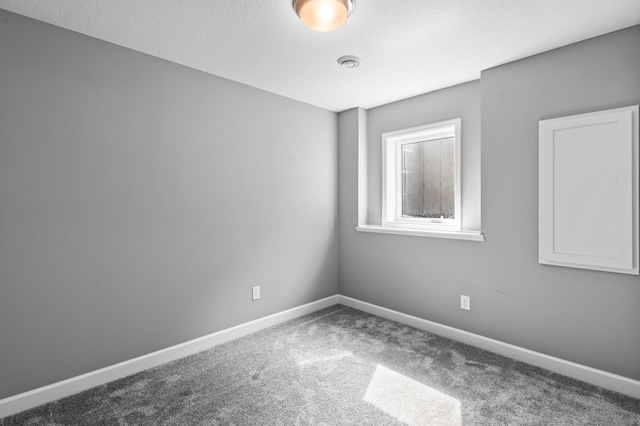 9842 51st St NE, Saint Michael, MN 55376 - unfurnished room with carpet flooring, baseboards, and a textured ceiling