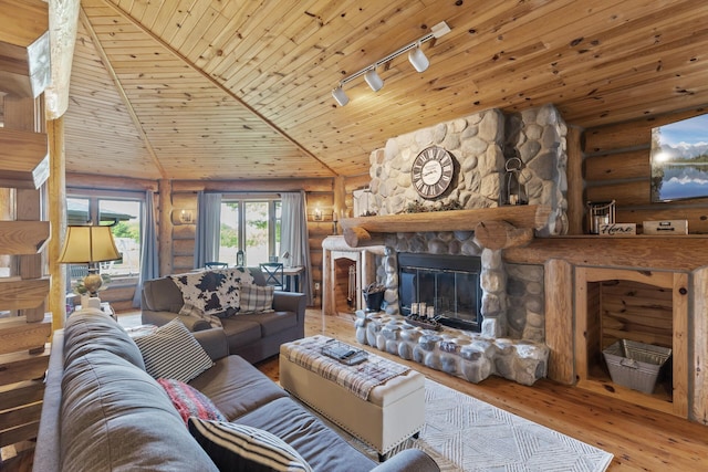 22165 Harlow Ave, Helena Twp, MN 55352 - living room with rustic walls, track lighting, wood-type flooring, wood ceiling, and a stone fireplace