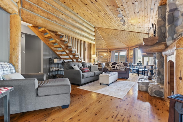 22165 Harlow Ave, Helena Twp, MN 55352 - living room with rustic walls, wood-type flooring, wooden ceiling, high vaulted ceiling, and stairs