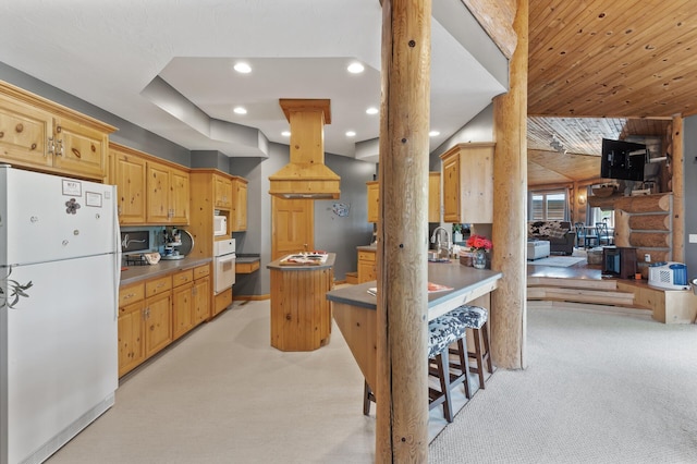 22165 Harlow Ave, Helena Twp, MN 55352 - kitchen with white appliances, light colored carpet, recessed lighting, a center island, and baseboards