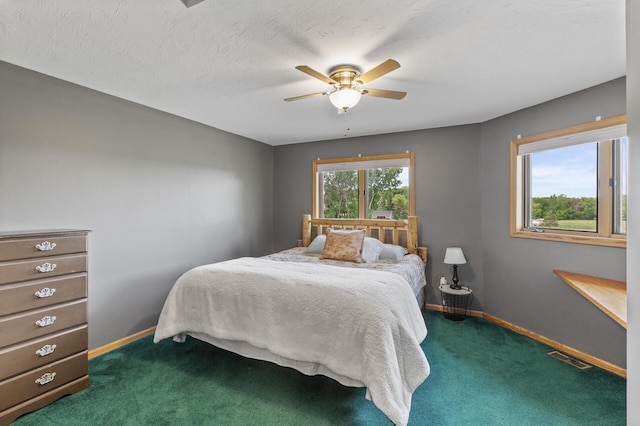 22165 Harlow Ave, Helena Twp, MN 55352 - bedroom featuring dark colored carpet, baseboards, and a ceiling fan
